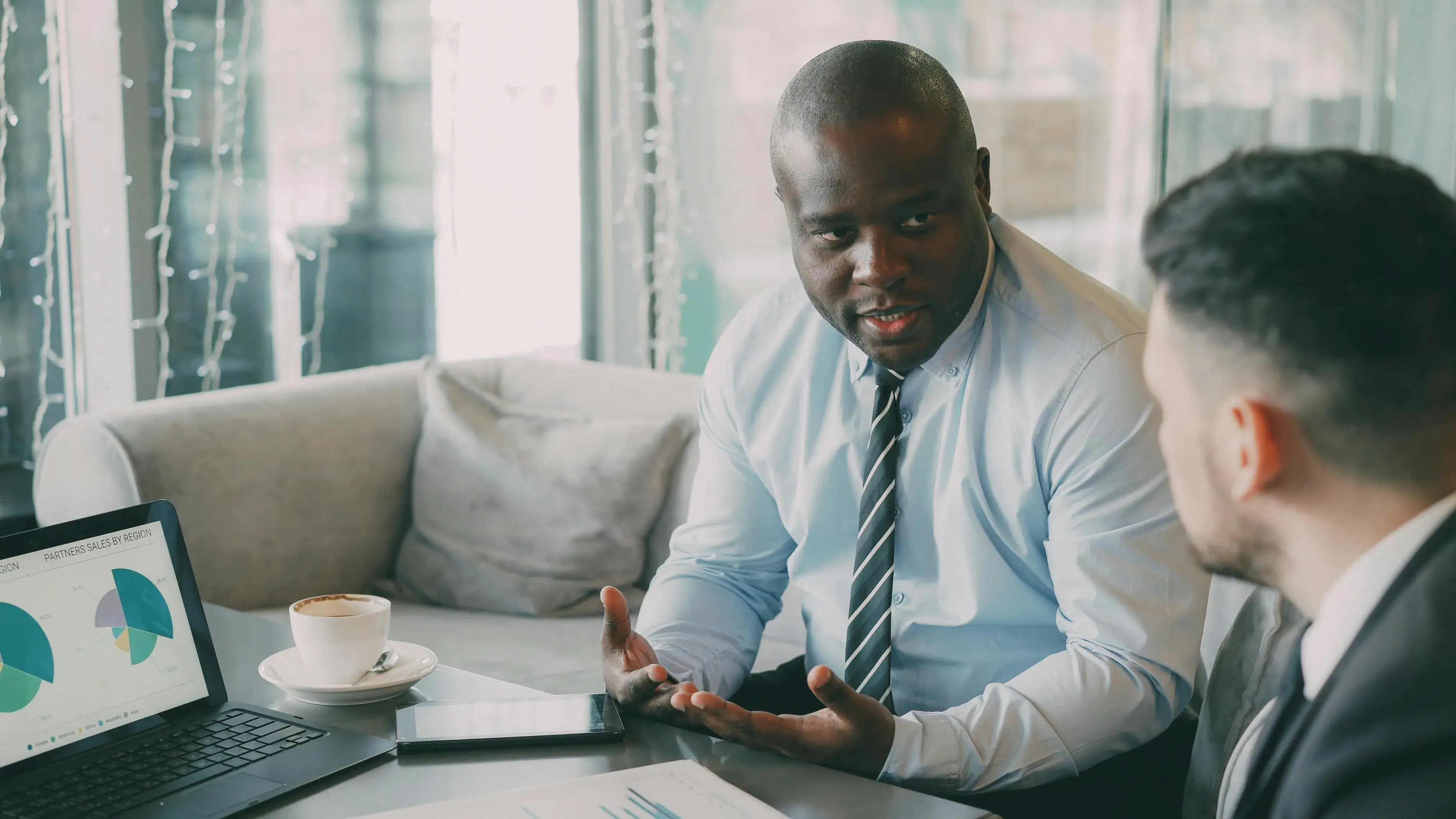A man discussing with his colleague