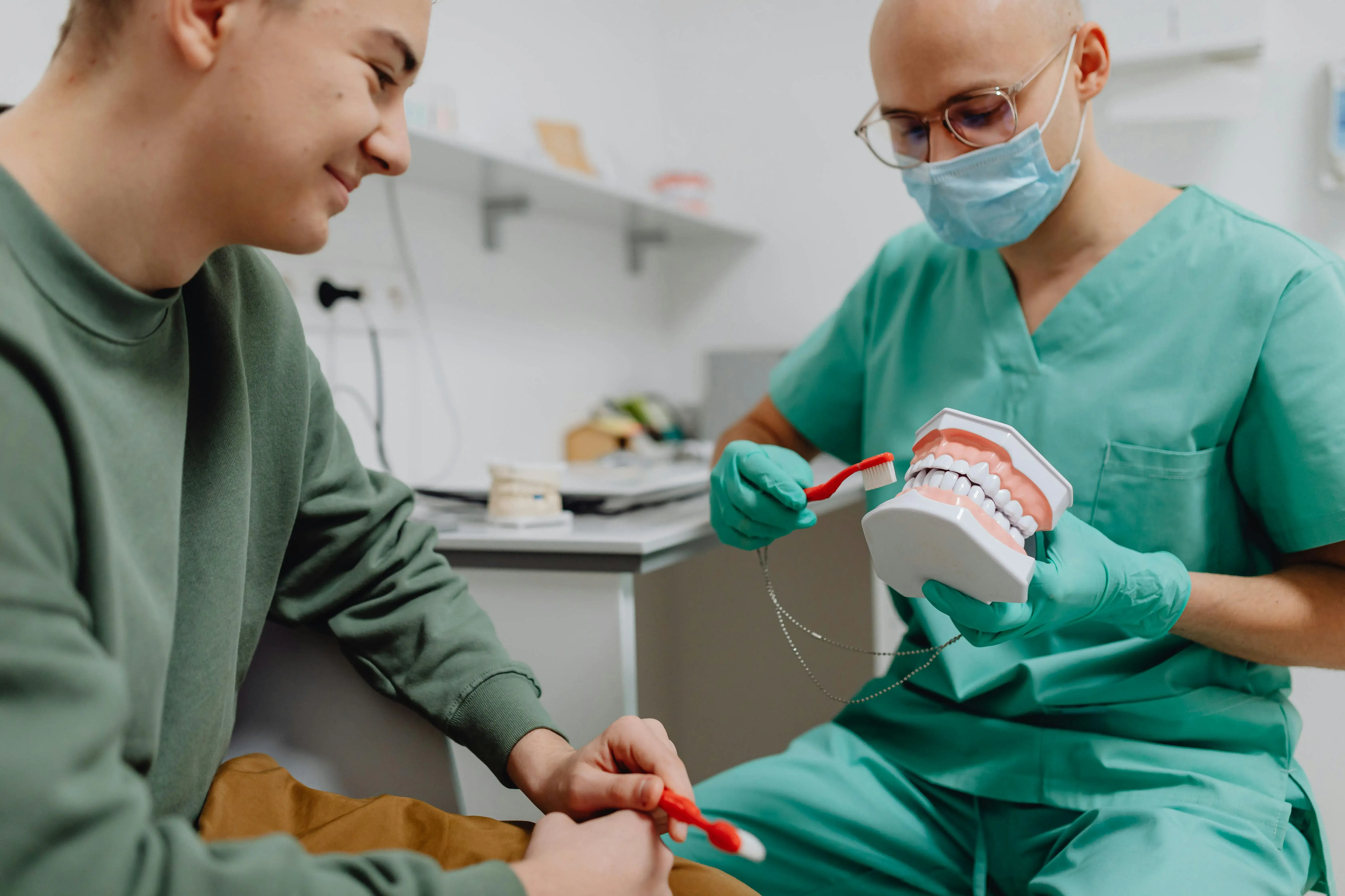 A doctor demonstrating dentures