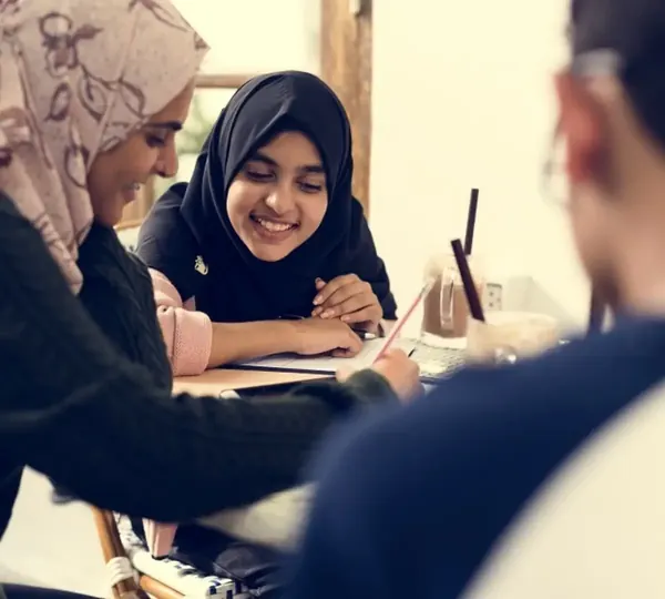 Teacher helping students study