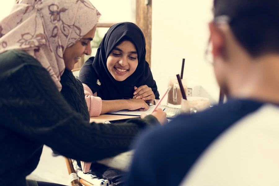 Teacher helping students study